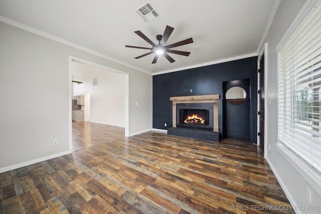 unfurnished living room with ornamental molding, dark hardwood / wood-style floors, and ceiling fan