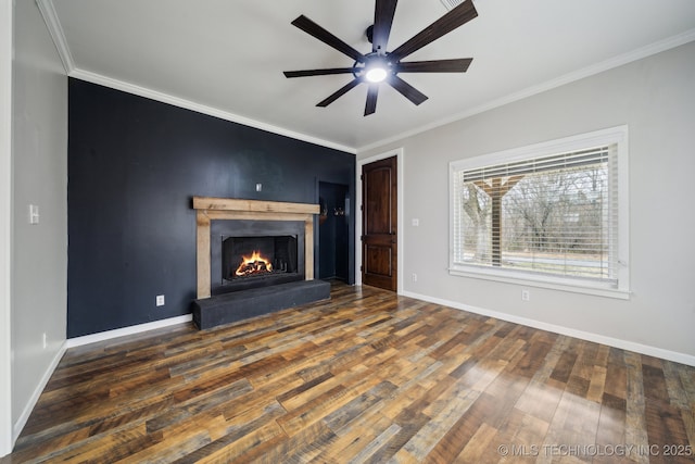 unfurnished living room with ornamental molding, dark wood-type flooring, and ceiling fan