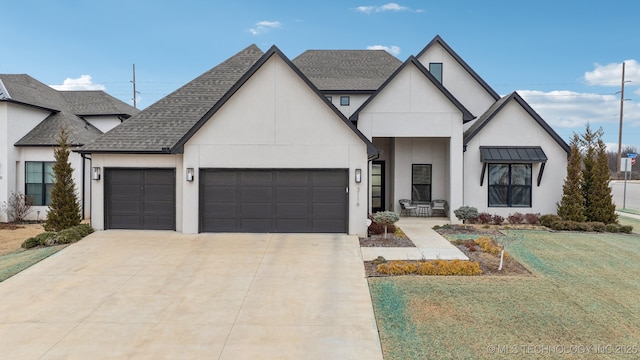 view of front of house with a garage and a front yard