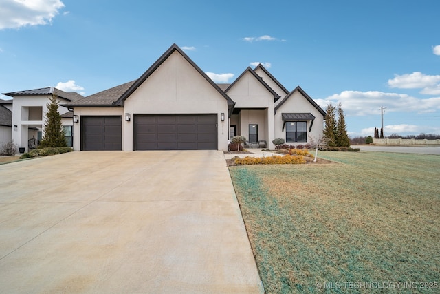 view of front of property featuring a garage and a front lawn