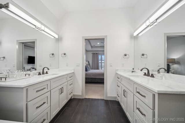 bathroom with vanity and lofted ceiling