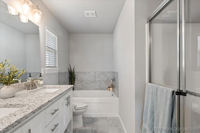 full bathroom featuring vanity, toilet, and separate shower and tub