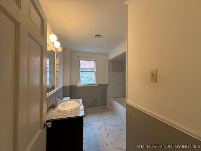 bathroom with vanity and crown molding