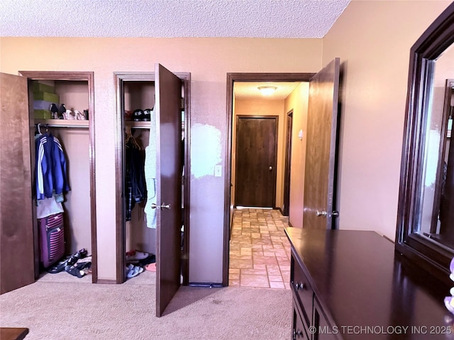 carpeted bedroom with a textured ceiling