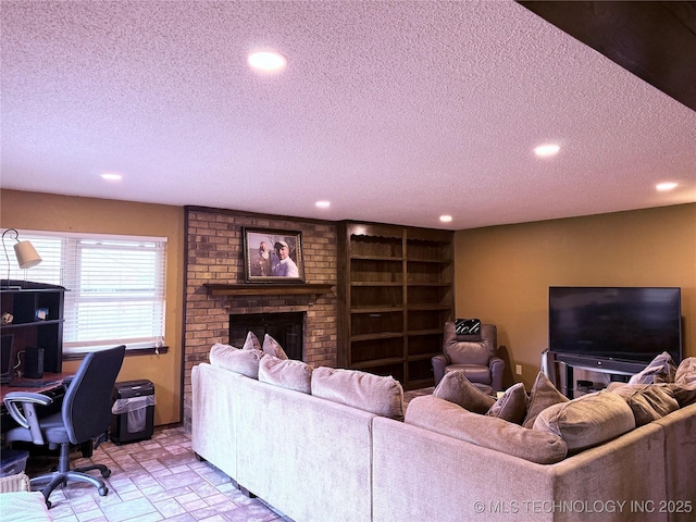 living room featuring a fireplace and a textured ceiling