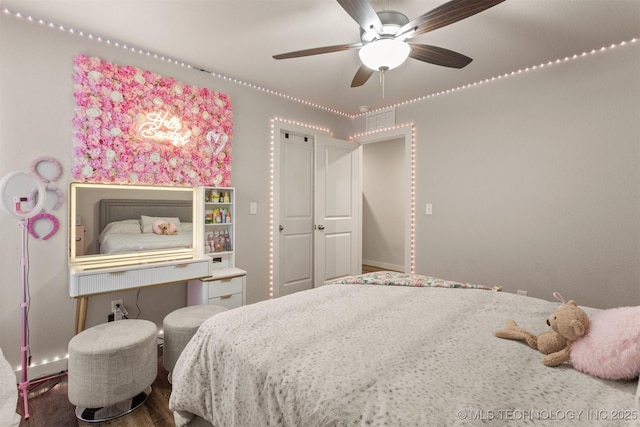 bedroom featuring hardwood / wood-style flooring and ceiling fan