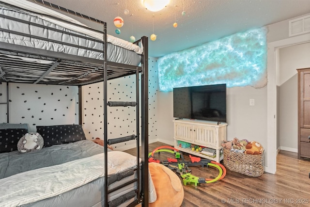 bedroom featuring hardwood / wood-style floors