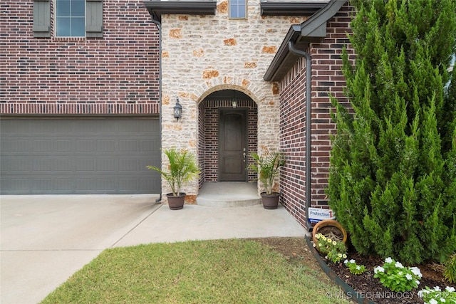 view of exterior entry featuring a garage