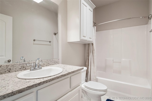 full bathroom with vanity, shower / tub combo with curtain, and toilet