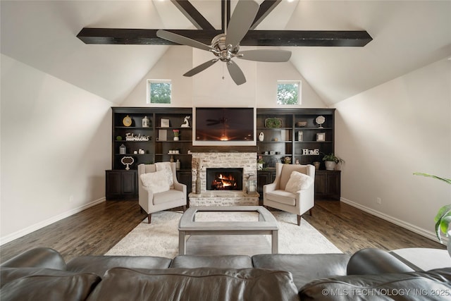 living room with lofted ceiling with beams, wood-type flooring, ceiling fan, and a fireplace