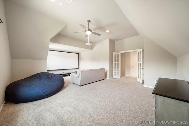 sitting room with lofted ceiling, french doors, ceiling fan, and carpet