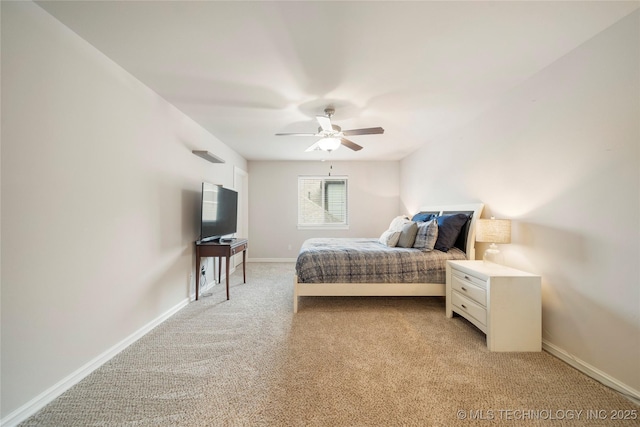 bedroom featuring light carpet and ceiling fan