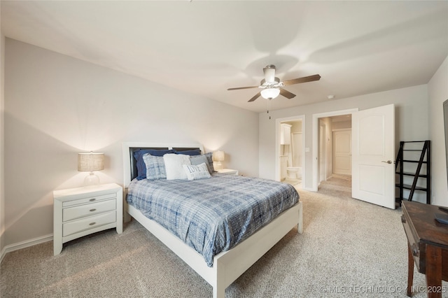 bedroom featuring connected bathroom, carpet floors, and ceiling fan