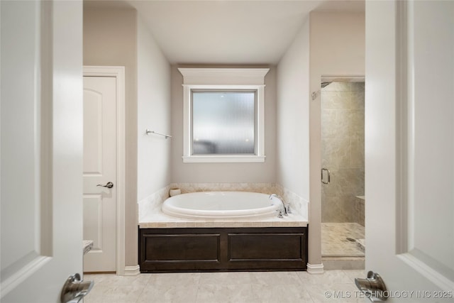 bathroom with plus walk in shower and tile patterned floors