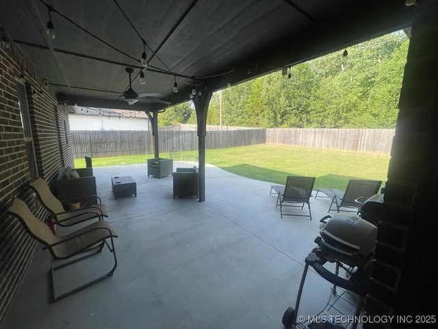 view of patio featuring ceiling fan