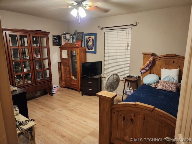 bedroom featuring ceiling fan and light hardwood / wood-style flooring