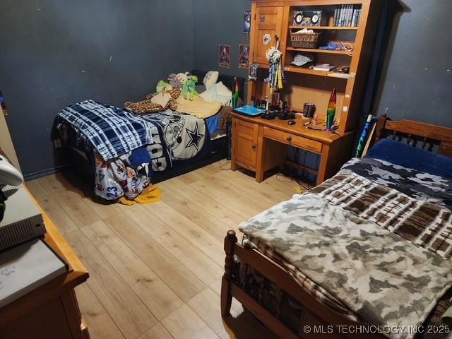 bedroom with light hardwood / wood-style flooring