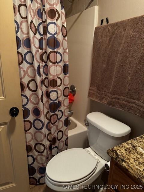 full bathroom with vanity, toilet, and shower / bath combo