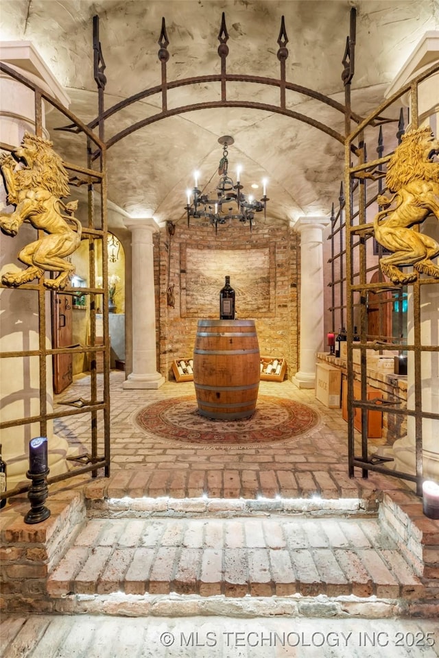 wine area with vaulted ceiling and ornate columns