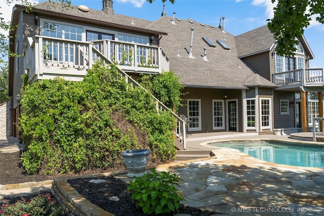 back of property featuring a patio area