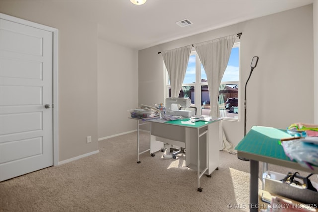 carpeted home office with visible vents and baseboards