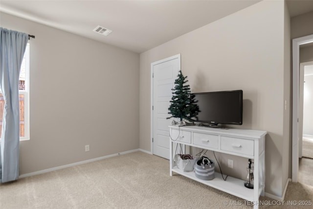 bedroom with carpet, visible vents, and baseboards