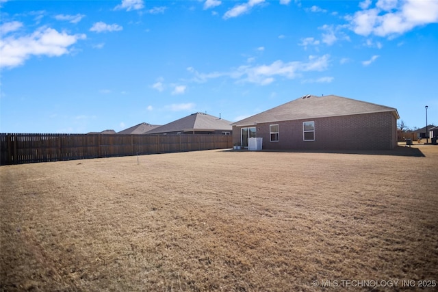 view of yard with a fenced backyard