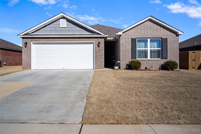 ranch-style home with an attached garage, concrete driveway, and brick siding