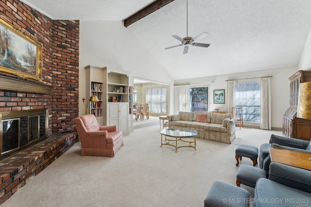 carpeted living room featuring high vaulted ceiling, a brick fireplace, a textured ceiling, ceiling fan, and beam ceiling