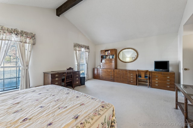 carpeted bedroom featuring multiple windows and lofted ceiling with beams