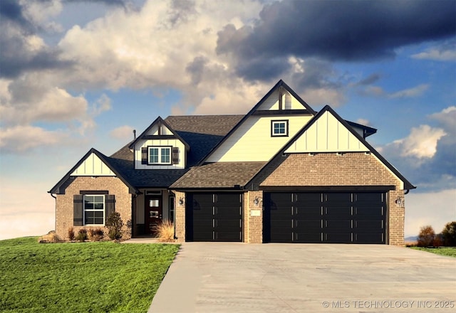 view of front of property featuring a garage and a front yard