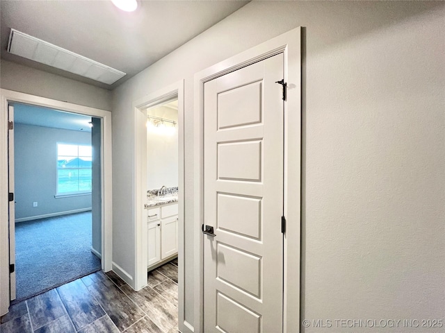 corridor featuring dark hardwood / wood-style flooring