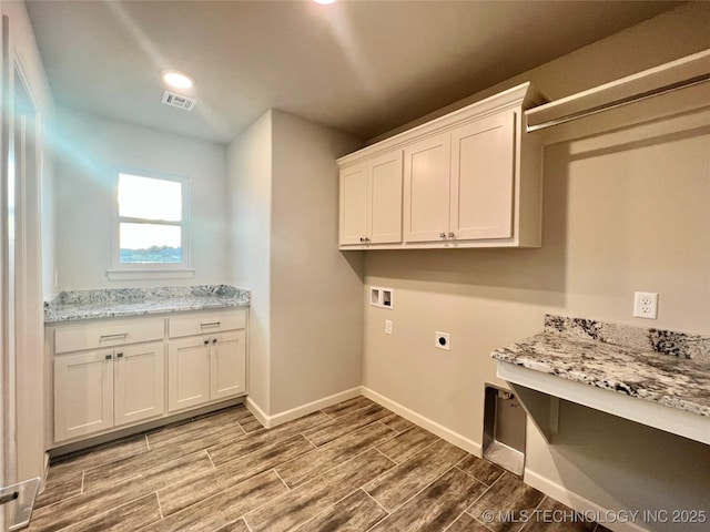 laundry room featuring cabinets, washer hookup, and hookup for an electric dryer