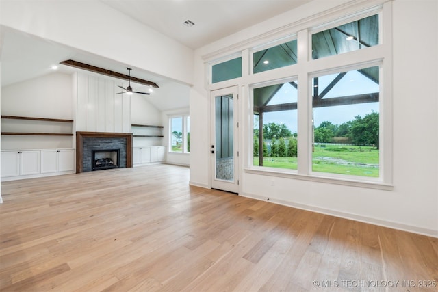 2722 E 134th Cir, Bixby, OK 74008 - unfurnished living room featuring lofted ceiling, light wood finished floors, a fireplace, and a ceiling fan