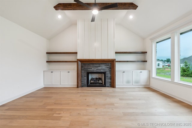 2722 E 134th Cir, Bixby, OK 74008 - unfurnished living room featuring lofted ceiling, light wood-style flooring, a fireplace, and ceiling fan