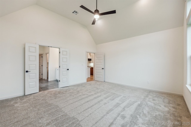 2722 E 134th Cir, Bixby, OK 74008 - unfurnished bedroom featuring carpet flooring, high vaulted ceiling, and a ceiling fan