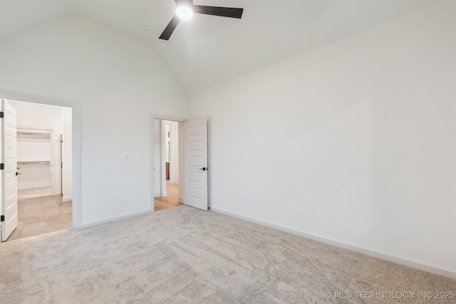 2722 E 134th Cir, Bixby, OK 74008 - unfurnished bedroom featuring light carpet, a walk in closet, ceiling fan, and high vaulted ceiling
