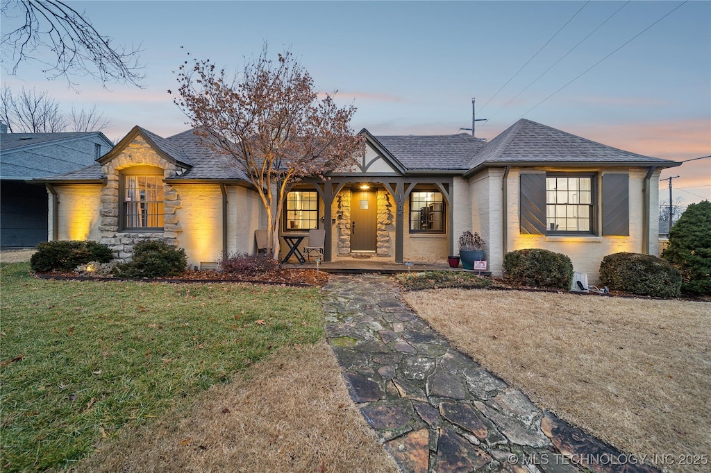 view of front of home with a yard