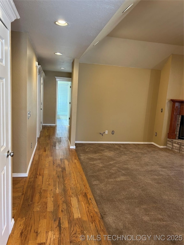 corridor featuring dark wood-type flooring