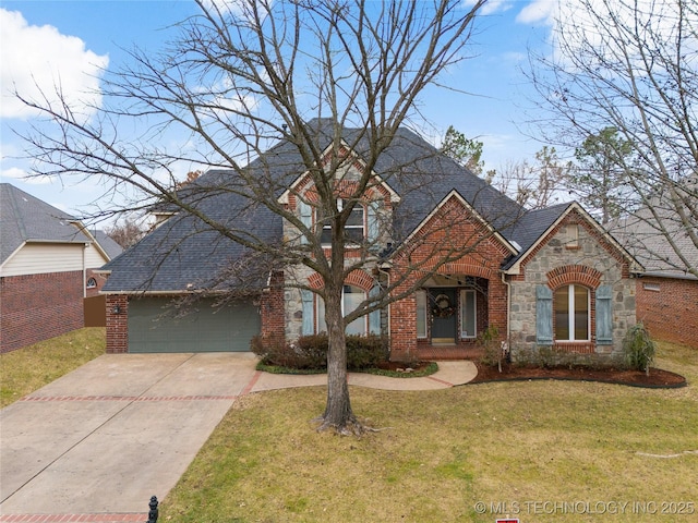 view of front facade with a garage and a front lawn