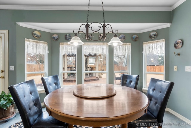 dining area featuring ornamental molding and a healthy amount of sunlight