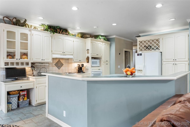 kitchen featuring white cabinetry, crown molding, a kitchen island, white appliances, and decorative backsplash