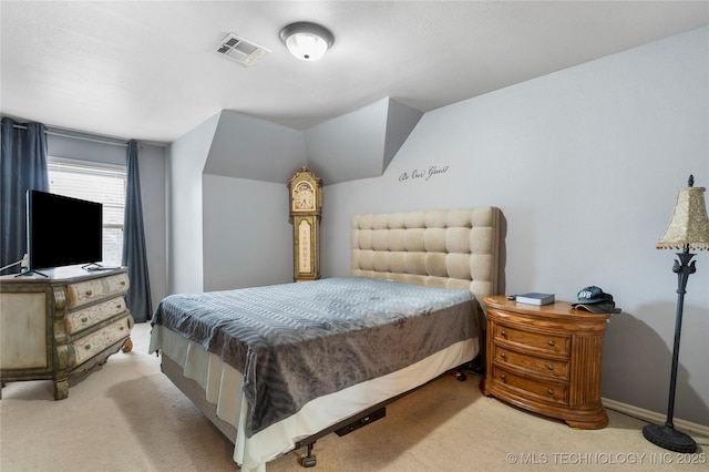 bedroom featuring light carpet and lofted ceiling