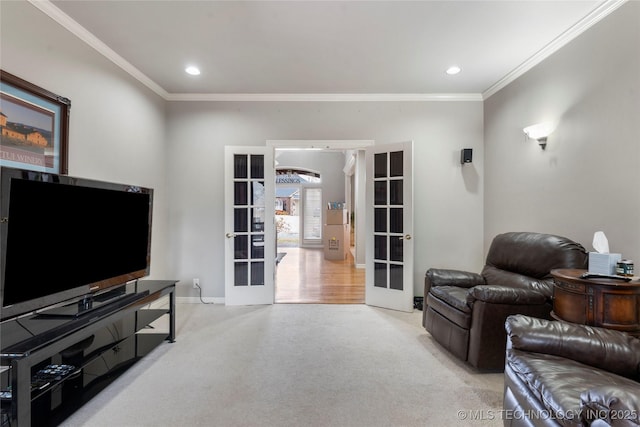 living room featuring crown molding, light colored carpet, and french doors