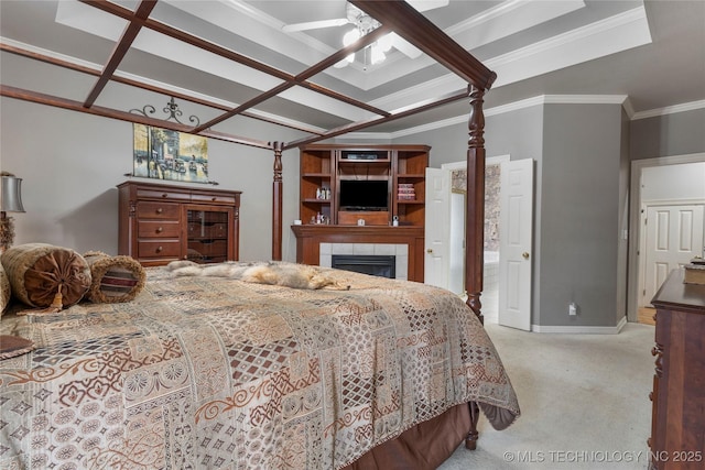 bedroom featuring ornamental molding, a fireplace, and light colored carpet