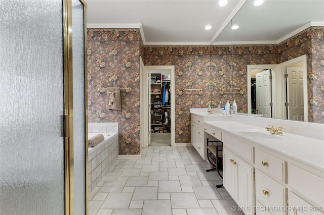 bathroom with crown molding, vanity, and separate shower and tub