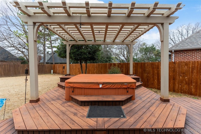 deck featuring a pergola and a covered hot tub