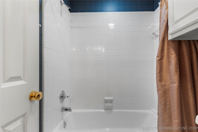 bathroom with shower / tub combo with curtain