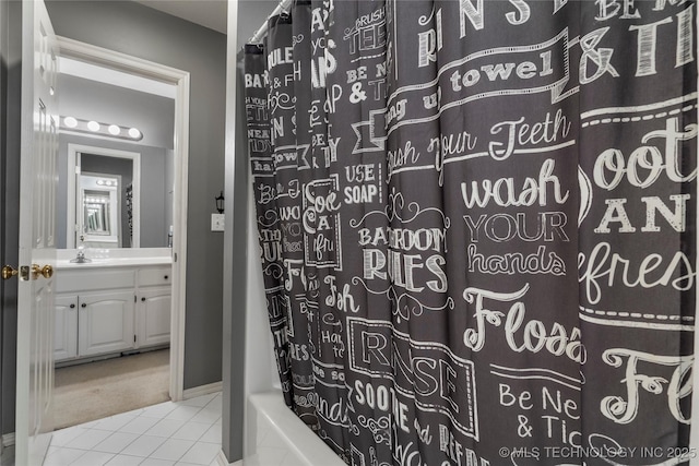 bathroom with shower / bath combination with curtain, tile patterned floors, and vanity