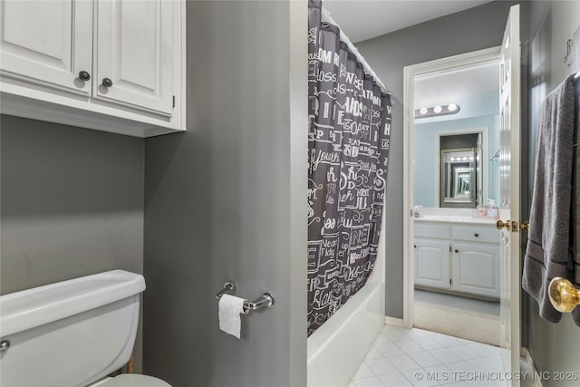 full bathroom featuring shower / tub combo with curtain, vanity, toilet, and tile patterned floors